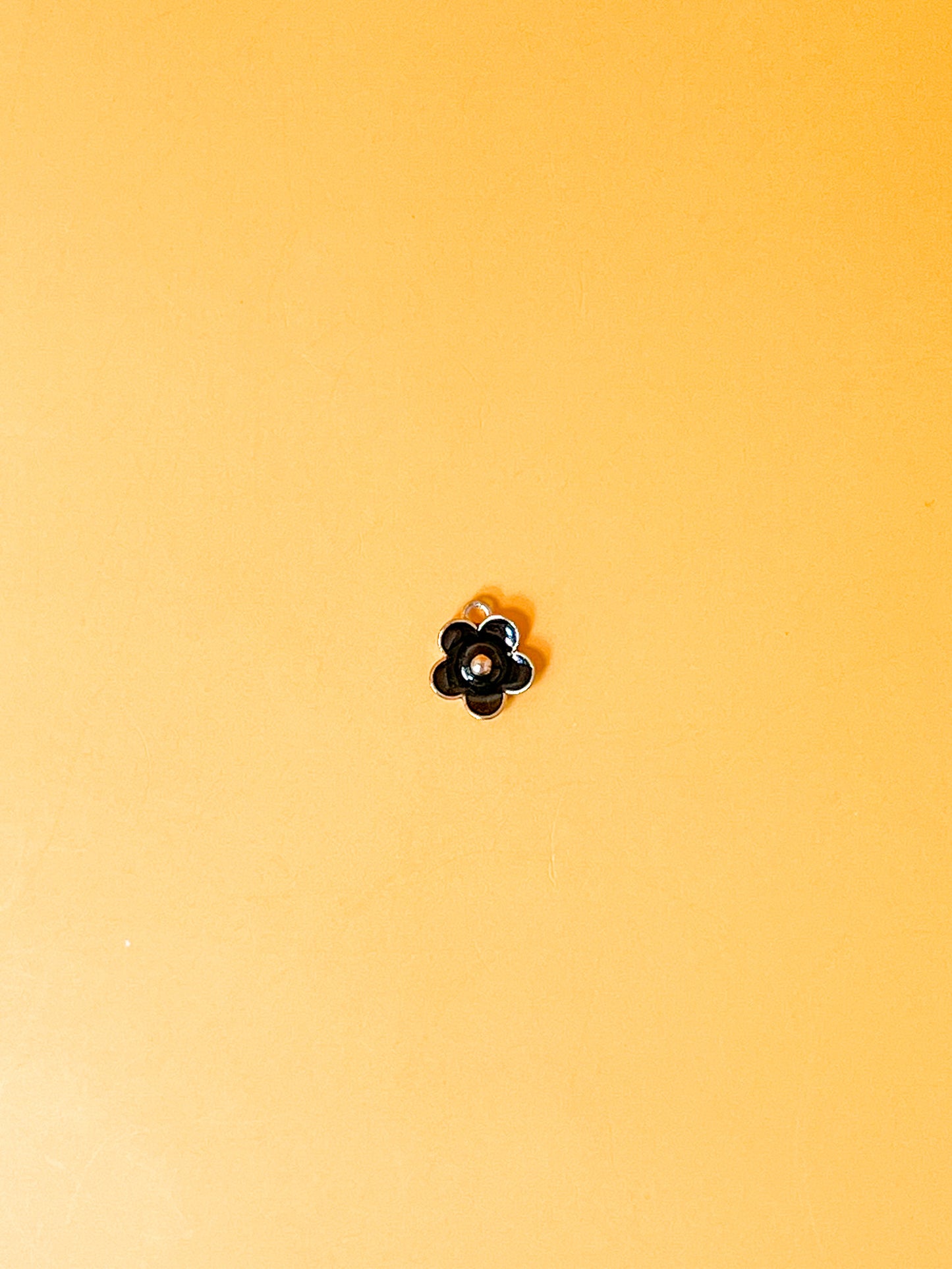 Black Daisy Charm